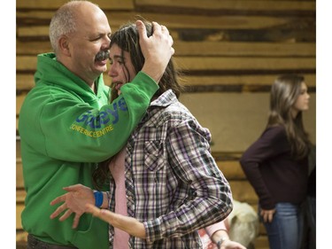 Rochelle Derraugh,13, gets a hug from her Dad Don as she can't hold back the tears of happiness after she meets and gets a photograph with the cast of CBC's hit TV show, Heartland, including Jessica Steen (Lisa Stillman), Alisha Newton (Georgie), Shaun Johnston (Jack Bartlett), Graham Wardle (Ty Borden), Amber Marshall (Amy Fleming), and Michelle Morgan (Lou Fleming) in support of HomeFront's 'Cool It, Calgary' campaign at the Symons Valley Ranch market in Calgary, on December 12, 2015.