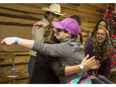 Sarah Blenkin, 26, hugs Jessica Steen (Lisa Stillman), of CBC's hit TV show, Heartland, at a cast meet and great including Alisha Newton (Georgie), Shaun Johnston (Jack Bartlett), Graham Wardle (Ty Borden), Amber Marshall (Amy Fleming), and Michelle Morgan (Lou Fleming) in support of HomeFront's 'Cool It, Calgary' campaign at the Symons Valley Ranch market in Calgary, on December 12, 2015.