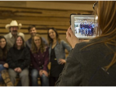 Kaylee Brown, 16, centre, gets a photo with the cast of CBC's hit TV show, Heartland, including Jessica Steen (Lisa Stillman), from left, Alisha Newton (Georgie), Shaun Johnston (Jack Bartlett), Graham Wardle (Ty Borden), Amber Marshall (Amy Fleming), and Michelle Morgan (Lou Fleming) in support of HomeFront's 'Cool It, Calgary' campaign at the Symons Valley Ranch market in Calgary, on December 12, 2015.