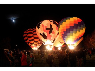Hot air balloons light up the sky at the Balloon Glow in High River on September 25, 2015. T