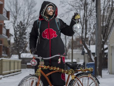 Gary Cape is homeless, but that hasn't stopped him from getting into the holiday spirit and decorating what he does have, his bike, with discarded decorations he finds in back alley dumpsters in Beltline Calgary, on December 18, 2015.