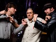 Renegade, left, and Baron von Kreuz are held back by Smith Hart during the announcement for Hopes & Ropes at Ranchmans in Calgary on Friday, Dec. 4, 2015.