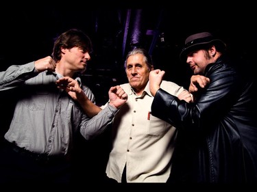 Renegade, left, and Baron von Kreuz are held back by Smith Hart during the announcement for Hopes  & Ropes at Ranchmans in Calgary on Friday, December 4, 2015.