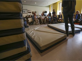 Extra mattresses are stacked next to a wall at Inn from the Cold's Beltline shelter on October 21, 2014.