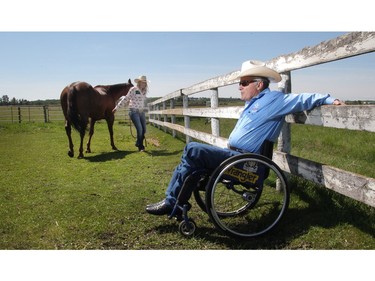 Barrel racer  Sydney Daines with her horse Flame and her dad, former Stampede bronc rider, Duane Daines, at the family's Diamond D ranch near Innisfail Wednesday June 24, 2015. This year will be the 18 year old's first Calgary Stampede. Her dad lost the use of his legs in a bronc riding accident in 1995.