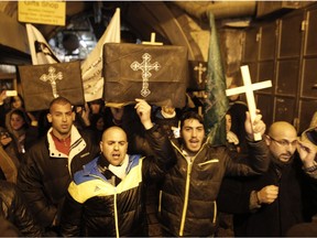 Christians take part in a symbolic funeral in Jerusalem's Old City  for the 21 Egyptian Coptic Christians beheaded by the Islamic State (IS) group on a Libyan beach.  A Canadian rabbi and a bishop have joined in an appeal for awareness of the persecution Christians face worldwide.