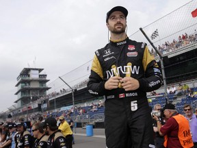 Canadian driver James Hinchcliffe, seen waiting for his turn to qualify for the Indianapolis 500 last May, and his team's Calgary-based co-owner Ric Peterson came up with the idea of bringing an IndyCar Series race to our city.