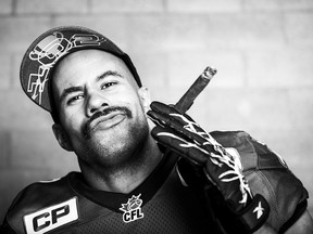 Calgary Stampeders running back Jon Cornish poses for a celebration photo after winning the 2014 CFL Grey Cup over Hamilton in Vancouver on Sunday, November 30, 2014.