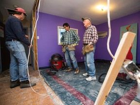 Murray Todd, centre, advises on the renovation taking place at the Cornerstone Youth Centre.