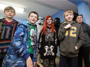 Kids wait their turn to speak to the media during a post Star Wars viewing pizza party at the Cornerstone Youth Centre in Calgary on Saturday, Dec. 19, 2015.