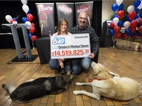 Monique and Christian Etienne of Airdrie take part in a press conference after winning $14,519,825 in the Dec. 12 Lotto 6/49 draw, in St. Albert Alta. on Tuesday Dec. 22, 2015.