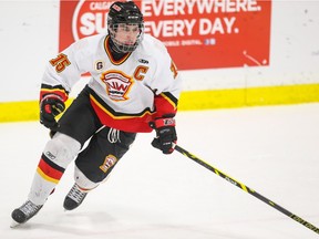 Calgary Flames forward Markus Boguslavsky drives back towards the California Wave net at Father David Bauer Arena in Calgary on Tuesday, Dec. 29, 2015. The Calgary Flames won over the California Wave, 2-1, in the second period of play during the Mac's Midget AAA Midget Hockey Tournament. (Aryn Toombs/Calgary Herald) (For Sports story by Laurence Heinen) 00071058A SLUG: 1229 macs midget - U of C area