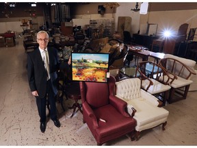 Frank Hall, president of Hodgins Art Auctions, in his company's warehouse.