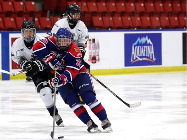 Pats Riley Woods works the puck down the ice as the Regina Pat Canadiens played the South Island Royals at the Mac's AAA Midget Hockey tournament on December 27, 2015 at the Max Bell arena.