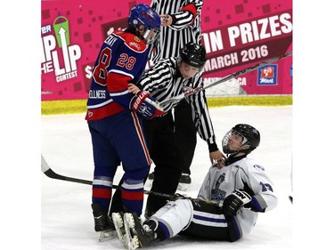 Pats Matthew Chekay, 28, and Royals Brandon McClintick, 10, got tangled up as the Regina Canadiens played the South Island Royals at the Mac's AAA Midget Hockey tournament on December 27, 2015 at the Max Bell arena.