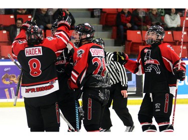 he Foothills CFR Chemical Bisons celebrate one of many goals as they played the Ontario Avalanche, who are from California, on  December 27, 2015.