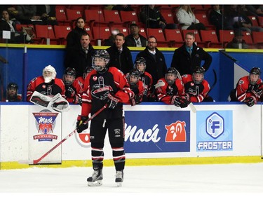 Cole Clayton in position in front of the bench he plays for as the Foothills CFR Chemical Bisons, his father Bruce also played in the Mac's Midget tournament.