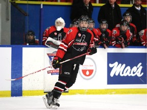 Cole Clayton is in position in front of the bench as he plays for as the Foothills CFR Chemical Bisons at the Mac's AAA Midget Hockey Tournament. His father Bruce also played for the Bisons.