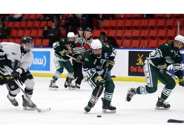 Northstars captain Brayden Dunn, 14, looks for a shot on net with teammate Jamie Rome, 9, while Kings Ashton Casault, 22, tries to catch up as the Calgary Northstars played the Sherwood Park Kings at the Max Bell Centre arena one on December 28, 2015.