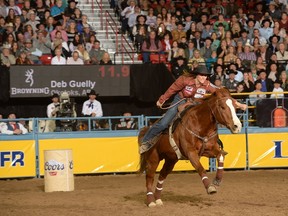 Okotoks barrel racer Deb Guelly earned her first cheque of the NFR on Wednesday night.