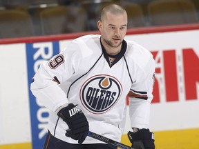 Shown in a 2010 file photo while with the Edmonton Oilers, Patrick O'Sullivan has hit the headlines after detailing longtime abuse at the hands of his father. On Thursday it came to light that Vancouver Canucks pest Alex Burrows crossed the line in trash talking O'Sullivan years ago.