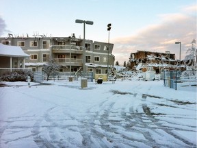 Lauren Ingalls, chief administrative officer with the Foothills Foundation, photographed the aftermath of the Medicine Tree Manor seniors' complex fire in High River on Wednesday, December 16, 2015.