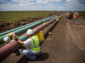 A crew works on a section of pipeline in North Dakota in this 2013 file photo.