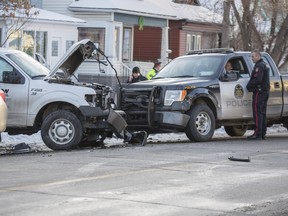 A stolen Ford F150 sits on the sidewalk of the 1600 block of 4th Street NW, after a police chase ended with the suspect trying to bash his way past police on the morning of Wednesday, December 23, 2015.