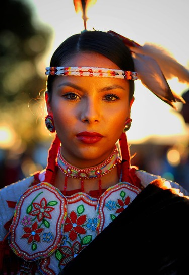 Nikita Kahpeaysewat waits to participate in the grand entry at the Kamloopa Powwow. From Moosomin First Nations in Saskatoon, the 19-year-old competes in the women’s traditional dance competition.