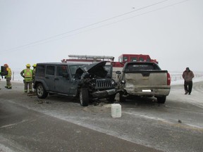 RCMP investigate a crash between a Jeep Wrangler and a Chevrolet Avalanche at Highway 567 and Range Road 284 on Friday, December 18, 2015. STARS airlifted a 68-year-old man to the Foothills Hospital and a 47-year-old woman was taken by ground ambulance to Peter Lougheed Centre.