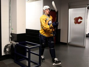 Buffalo Sabres rookie Jack Eichel walks to the ice surface at the Scotiabank Saddledome for practice on Wednesday.