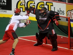 Roughnecks' Tyler Digby, who came over in the Shawn Evans blockbuster trade, scores the opening goal of Sunday's National Lacrosse League exhibition game on Vancouver Stealth goalie Eric Penney.