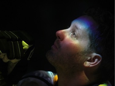 An emotional Rod O'Brien watches a jumbotron tribute to his late son Nathan before the start of the Nathan O'Brien Children's Foundation hockey game Thursday February 5, 2015 at the Saddledome. A team made up of Nathan's family, local police and politicians took on a Calgary Flames Alumni squad.