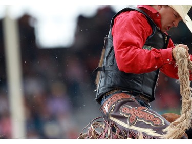 Zeke Thurston of Big Valley AB rode Rubels in the Saddlebronc to a score of 88.50 at the Stampede finals on July 12, 2015. He ended up riding three horses before he earned first place and $100,000.