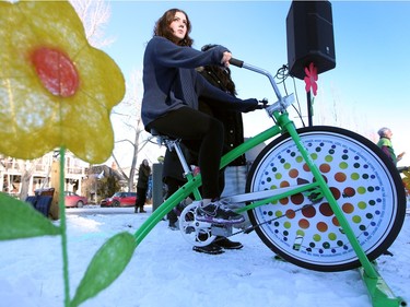 Sayda Kemna hopped on a big to help provide pedal power to the audio system as roughly 300 Calgary climate activists took part in a climate change protest at Royal Sunalta Park in Calgary on November 29, 2015.