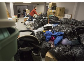 Volunteer Chadwick Jones organizes goods at a warehouse in the northeast collecting donated items for Syrian refugees in need.