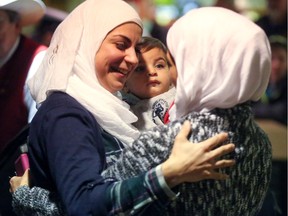 The Abbara family is welcomed by Calgarians at the Calgary International Airport  on Dec. 18.