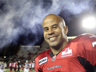Calgary Stampeders running back Jon Cornish grins as the fireworks go off after their 39-15 win over the Edmonton Eskimos Friday night September 28, 2012 at McMahon Stadium. Cornish passed the 1,000 yards rushing mark in the game.