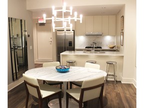 The dining area and kitchen in a show suite at Bridgeland Crossings II, by Apex City Homes and Gablecraft Homes in The Bridges. Andrea Cox for the Calgary Herald