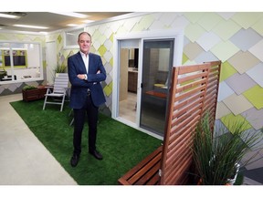 John Brown, associate dean in the U of C's Faculty of Environmental Design, stands outside a laneway home that architectural students have designed and built. The home integrates home health and aging-in-place that could be constructed in the backyard of a standard residential lot.