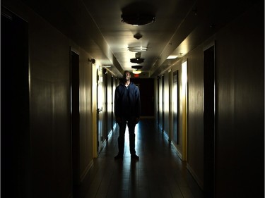 Tong Liech stands in a hallway leading to various client bedrooms at the Fresh Start Recovery Centre in Calgary on Tuesday, October 27, 2015.