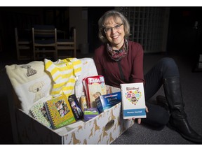Professor Karen Benzies displays a baby box expectant mothers in Alberta will receive this year as part of a research study called Welcome to Parenthood.