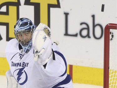 Tampa Bay Lightning goalie Ben Bishop watches as he misses the glove save during game action against the Calgary Flames at the Saddledome in Calgary, on January 5, 2016. --  (Crystal Schick/Calgary Herald) (For Sports story by  TBA) 00068697A