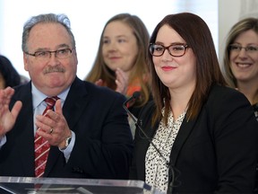 Independent MLA Deborah Drever, right, and government house leader Brian Mason during a press conference at Bowness Scouts and Lions Hall in Calgary on Jan. 8, 2016.