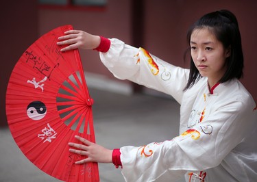 Cheryl Wan, 15, practices her tai chi fan before performing with the Calgary Tai Chi and Martial Arts College during the opening ceremonies of the 2016 Year of the Monkey Chinese New Year Carnival at the Chinese Cultural Centre.