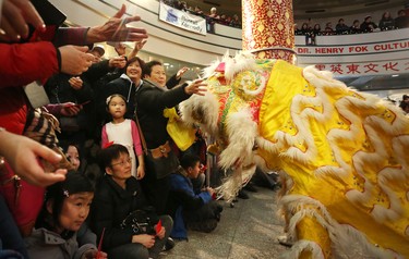 Members of the Calgary Tai Chi and Martial Arts College performs the lion Dance and hand out red envelopes during the opening ceremonies of the 2016 Year of the Monkey Chinese New Year Carnival at the Chinese Cultural Centre in Calgary, Ab., on Saturday January 30, 2016.
Photo by Leah Hennel/Postmedia