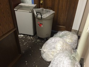 A couple bags of shredded papers lie inside the common area of the minister of energy and minister of infrastructure offices in Edmonton on May 6, 2015.