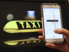 Uber, the mobile phone app that allows users to get a taxi, private car or rideshare, is available in Airdrie, Alta. Photo illustration taken at the Airdrie Echo office on Friday November 6, 2015 in Airdrie, Alta. Britton Ledingham/Airdrie Echo/Postmedia Network