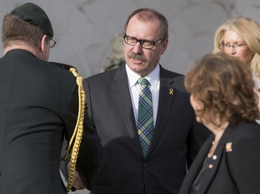 Ric McIver, the interim leader of the Alberta Tories, glad-hands after the funeral of Ronald D. Southern at Spruce Meadows in Calgary, Alta., on Thursday, Jan. 28, 2016. Ron Southern, a prominent philanthropist and businessman, is best known for start the Spruce Meadows show jumping facility 40 years ago and building ATCO into an international business powerhouse. Lyle Aspinall/Postmedia Network