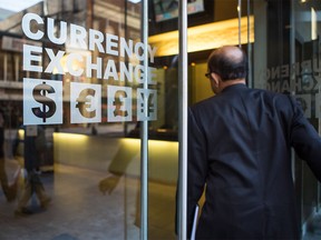 A man enters the Calforex Currency Exchange on Stephen Avenue in Calgary.